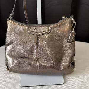 Coach metallic gold leather swingpack